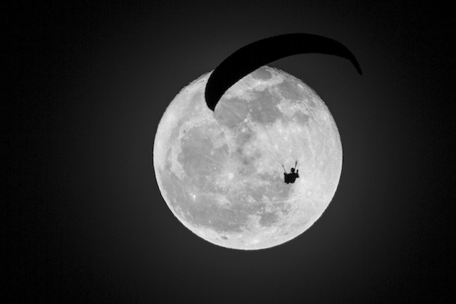Paragliding during full moon