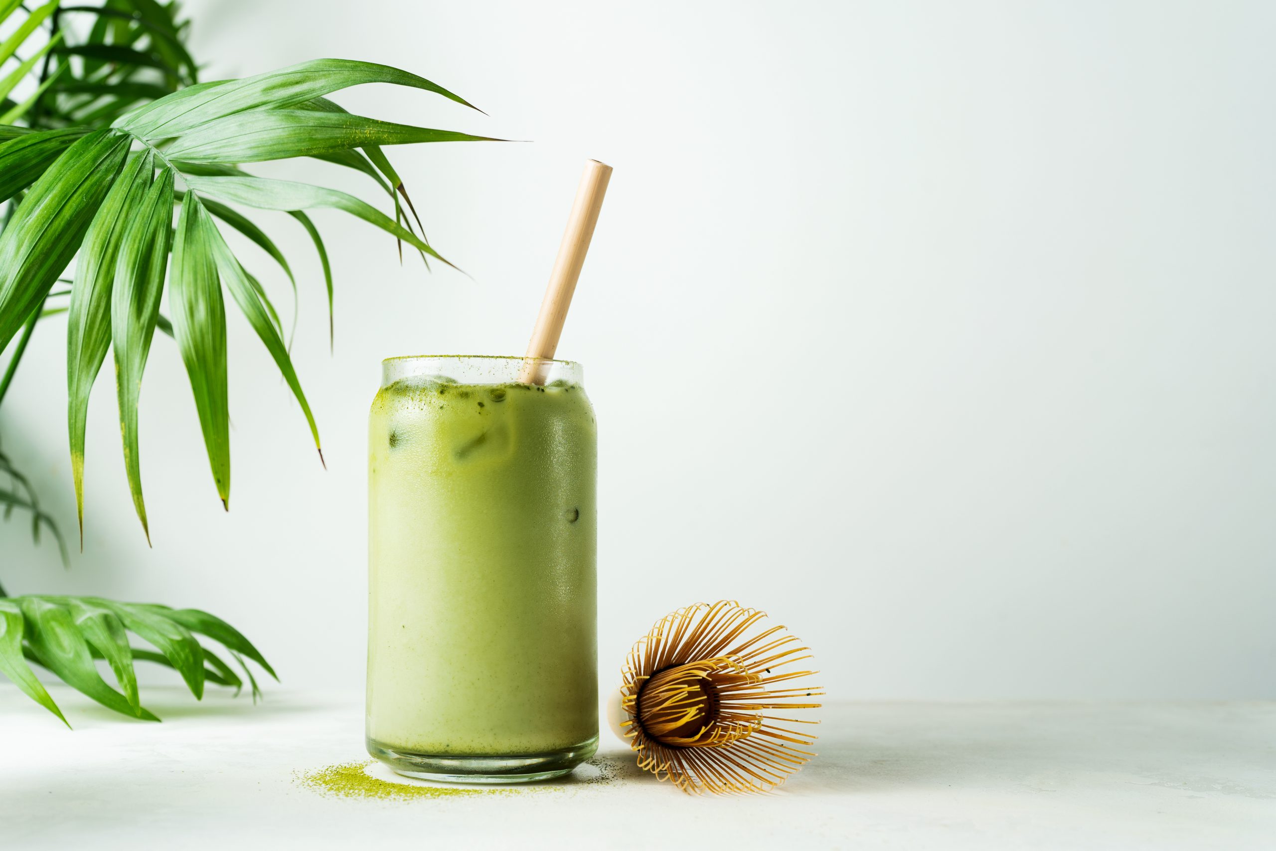 A glass drink of Matcha latte